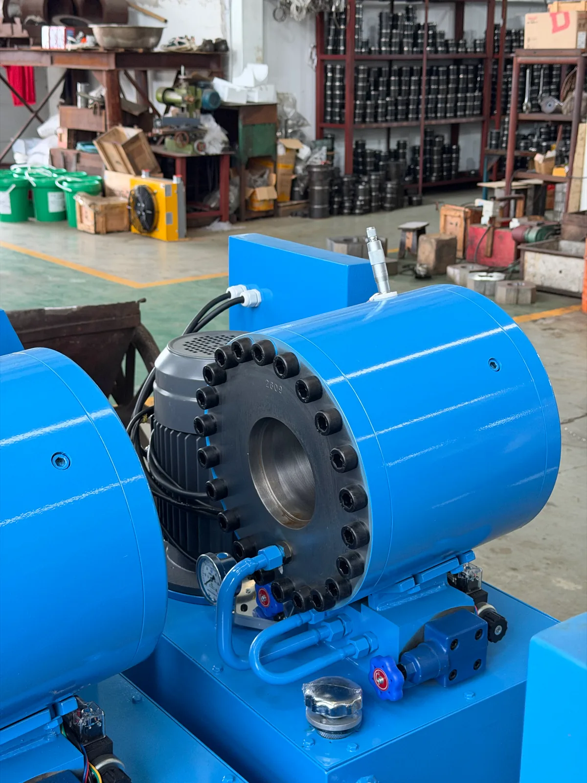 Head of a hydraulic hose crimping machine in a workshop
